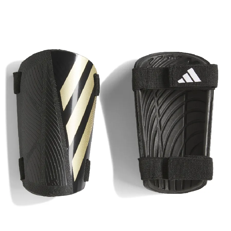 Imagen 0 de 3 de Canilleras adidas Tiro-NEGRO/DORADO